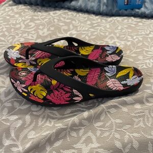 CROCS Women's Black Flip Sandals with Pink Yellow Purple Tropical Print